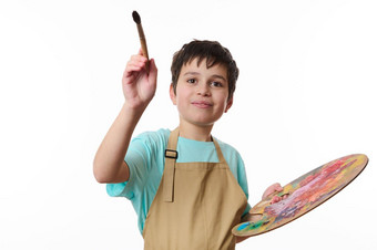 有才华的十几岁的男孩艺术家画家调色板色彩斑斓的石油油漆绘<strong>画画笔</strong>前面相机