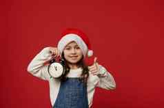 高加索人微笑女孩圣诞老人老人他显示报警时钟午夜刻度盘拇指相机