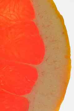 葡萄柚新鲜的有机葡萄柚片白色背景葡萄柚特写镜头片血红色的成熟的葡萄柚纹理红色的多汁的葡萄柚宏细长立式图像