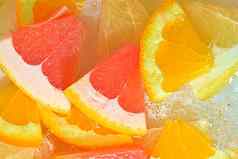 特写镜头视图葡萄柚橙色水果蜂蜜葡萄柚片水背景纹理冷却水果喝宏泡沫玻璃墙平设计水平宏图像夏天水果背景
