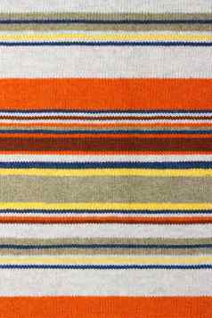 色彩斑斓的条纹状的马海毛羊毛织物纹理关闭织物多色背景