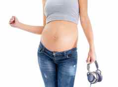 音乐怀孕了女人胃工作室跳舞有趣的庆祝活动白色背景耳机怀孕肚子怀孕了女人听播客健康站孤立的