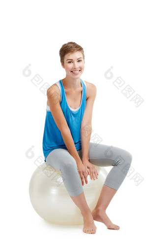 球锻炼<strong>好友</strong>工作室拍摄年轻的女人坐着锻炼球