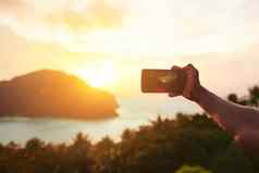 日落诗单词无法辨认的旅游智能手机照片岛视图