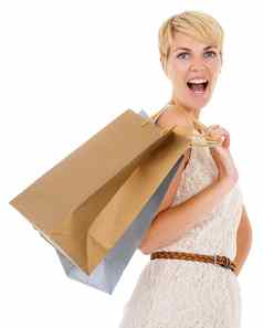 兴奋令人惊异的购物疯狂漂亮的年轻的女人携带购物袋孤立的白色背景