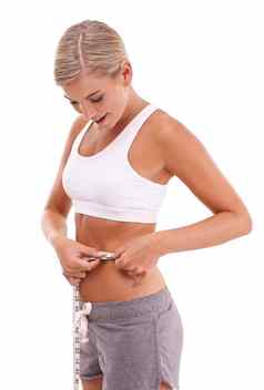 健康健身女人磁带测量腹部工作室孤立的白色背景饮食健康苗条的女模型测量腰跟踪减肥法目标进步目标