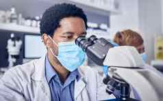 科学科维德黑色的男人。实验室显微镜脸面具动机未来疫苗发展医疗保健科学家药剂师的想法创新医疗研究