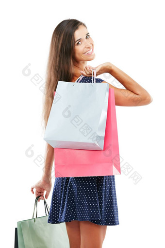 <strong>支付</strong>一天对<strong>待</strong>工作室肖像有吸引力的年轻的女人携带购物袋白色背景