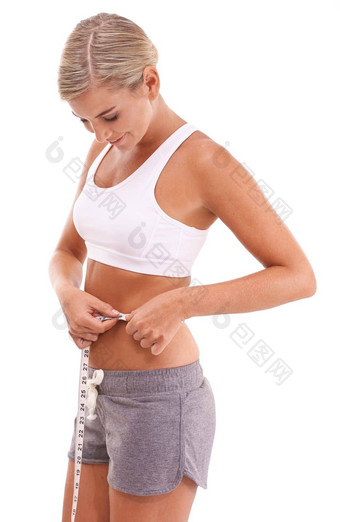 健身健康女人磁带测量腹部工作室孤立的白色背景饮食健康苗条的女模型测量腰跟踪减肥法目标进步目标