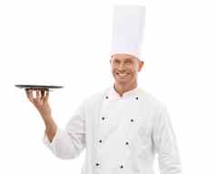 老板持有托盘自信肖像微笑展示促销餐厅产品放置孤立的白色背景快乐执行烹饪男人。统一的模拟菜单发射工作室