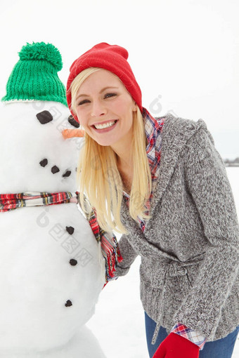 肖像冬天女人雪人圣诞节雪脸前面女雪男人。圣诞节节日季节庆祝有趣的微笑
