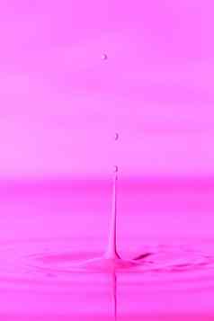 下降瀑布厚液体粉红色的背景摘要色彩斑斓的背景