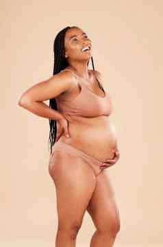 怀孕配置文件内衣工作室女人微笑快乐兴奋婴儿胃增长母亲妇科孕妇护理怀孕了非洲模型医疗保健爱希望