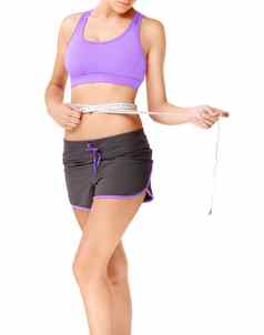 好处锻炼苗条的女人健身房服装磁带测量测量腰围
