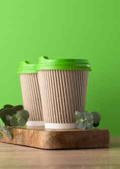 纸棕色（的）杯塑料绿色成员咖啡茶绿色背景