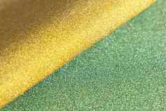 金绿色波软闪亮的闪闪发光的纸纹理闪亮的豪华的织物泛着微光光绿色金颜色圣诞节背景