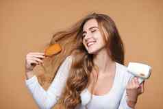 女人强大的健康的头发头发干燥机