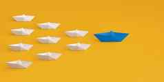 纸船领导蓝色的白色船黄色的背景社会媒体互联网追随者概念