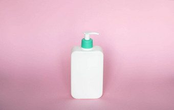 白色未打上烙印的瓶自动售货机孤立的粉红色的背景<strong>化妆品包</strong>装模型复制空间瓶淋浴过来这里肥皂