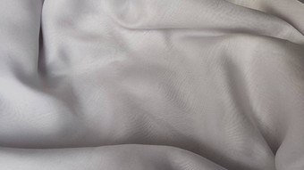 摘要雪纺织物<strong>背景</strong>白色纹理波违规行为创建框架光精致的美丽的窗帘