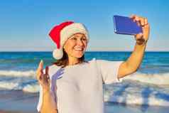 一年圣诞节假期快乐女人圣诞老人他海滩使视频调用