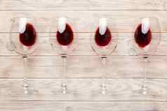 眼镜红色的酒酒品尝概念红色的酒彩色的背景前视图平躺设计