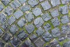 背景纹理轮古董石头灰色的铺路材料雨滴