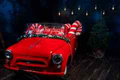 而红色的车领导红色的登记快乐圣诞节大圣诞节棒棒糖车工作室背景