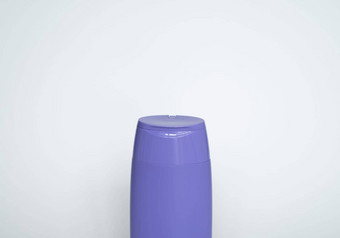紫罗兰色的塑料<strong>瓶身</strong>体护理美产品工作室摄影塑料<strong>瓶</strong>洗发水淋浴过来这里噪音孤立的白色背景