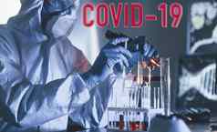 红色的科维德词科学家保护统一的工作病毒在室内实验室测试管显微镜