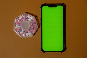 移动电话浓度关键绿色屏幕复制空间模板医疗药丸盒子剂量平板电脑每天医学白色粉红色的药物胶囊每天维生素首页健康护理疾病治愈
