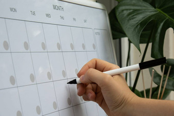 女手写作标记每月规划师磁董事会天月的地方输入重要的重要的时间表概念业务规划白板规划师磁每月模板