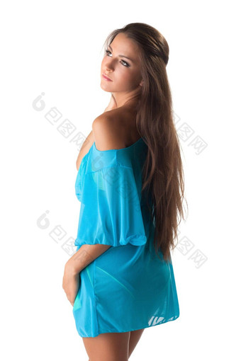 漂亮的年轻的女孩摆姿势蓝色的背心裙