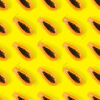 新鲜的成熟的<strong>木瓜</strong>无缝的模式黄色的背景热带摘要背景前视图