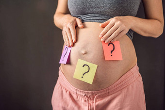 选择婴儿困惑怀孕了女人问题标志着纸贴纸肚子