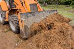挖掘机推土机桶趋于平缓地面路工业区建设网站
