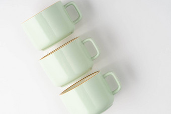 集白色柔和的绿色陶<strong>瓷茶杯</strong>橙色概述了