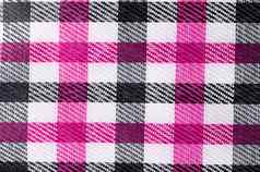 粉红色的黑色的颜色条格平布模式织物纹理背景