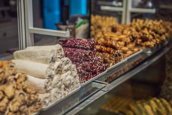 传统的东方甜蜜的糕点饼干坚<strong>果干水</strong>果芯块果酱土耳其沙漠糖蜂蜜阿月浑子显示街食物市场