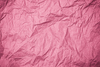 前视图皱纹变形纸粉红色的皱巴巴的纸纹理背景皱纹摘要纸背景