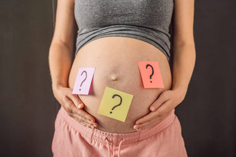 选择婴儿困惑怀孕了女人问题标志着纸贴纸肚子