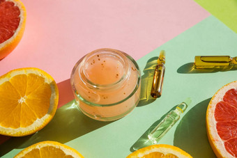 化妆品瓶容器脸奶油橙色片自然美产品概念成熟的新鲜的有机橙色水果葡萄柚安瓿至关重要的橙色石油提取柔和的背景