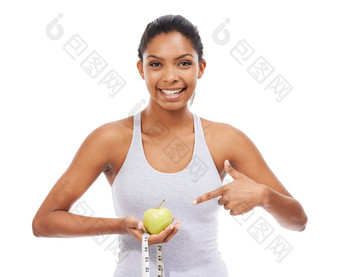饮食健康的收获奖励漂亮的年轻的女人指出苹果测量磁带孤立的白色