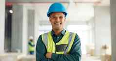 建设建筑建设工人男人。微笑肖像员工建设网站工作背心安全头盔工作体系结构行业改造工作