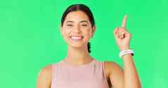 快乐女人脸指出显示促销活动产品放置绿色屏幕幸福微笑模型手势广告商业交易孤立的工作室背景