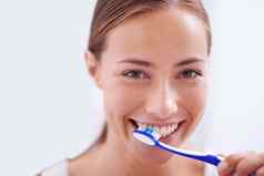 女人肖像刷牙牙齿浴室微笑健康护理口服卫生健康例程女孩牙刷幸福清洁健康的口开始早....