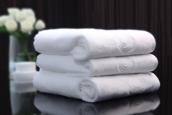 白色毛巾布草布料居家洗护用品酒店宾馆旅店商务住宿摄影图
