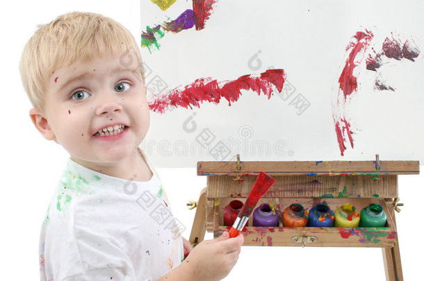 画架上可爱的小男孩画画