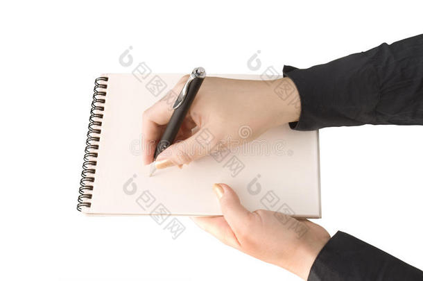 手拿笔记本，另一只手拿笔和手腕