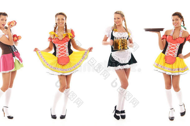 四个年轻的巴伐利亚女孩穿着裙子摆姿势